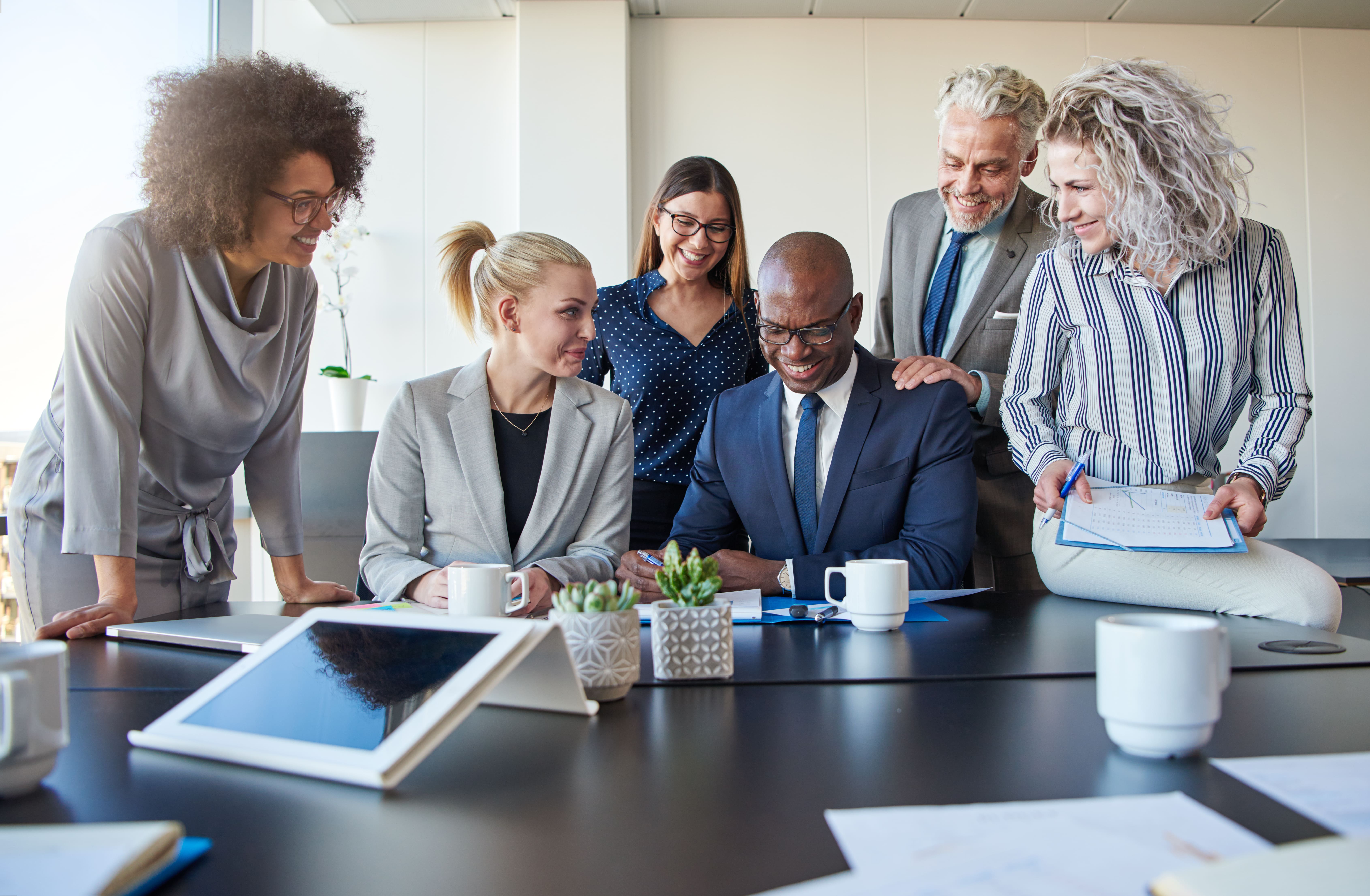 Smiling colleagues working together at a table