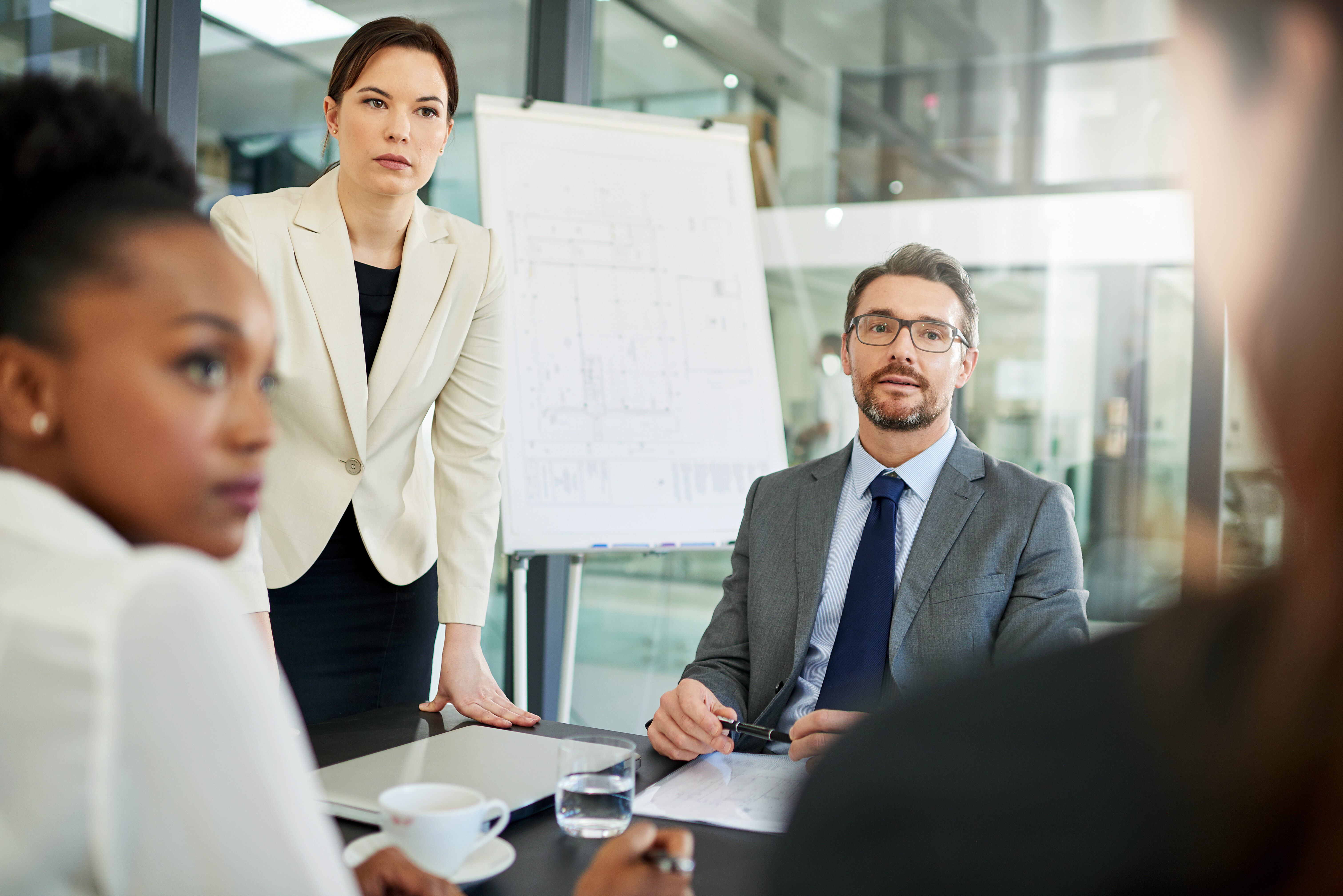 Business professionals in a meeting discussing leadership development